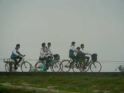 bicyclists in the rain - Vietnam
